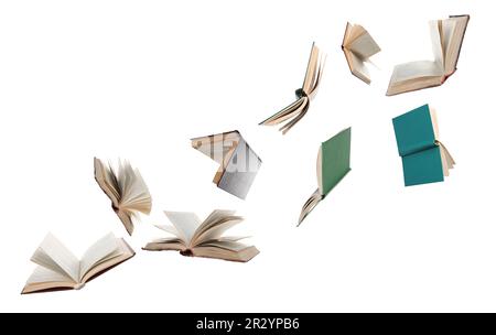 Many hardcover books flying on white background Stock Photo