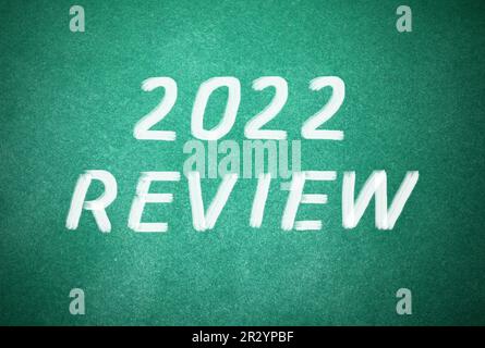 Text 2022 Review written on green chalkboard Stock Photo