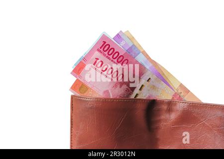 Hand showing rupiah money from wallet isolated on white background ...