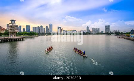 Dragon Boats practicing in Kallang Basin, near Singapore Sports Hub. It is a sports and recreation district in Kallang, Singapore. Stock Photo