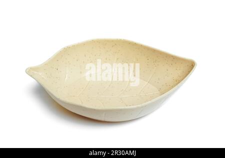 a serving bowl in the shape of a leaf isolated on white background Stock Photo