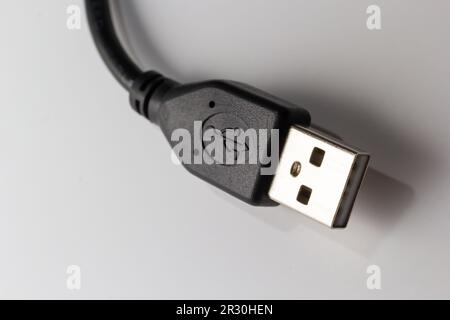 Close up of USB cable on white background. Data transfer technologies between devices via cable. Stock Photo