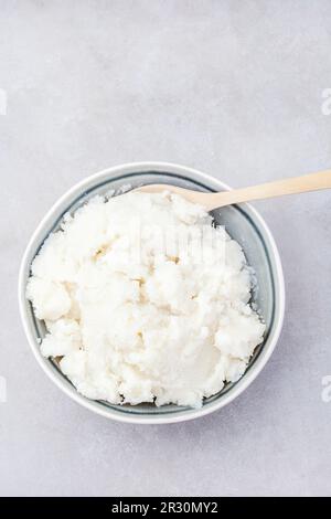 Traditional South African pap or maize meal on mottled grey Stock Photo