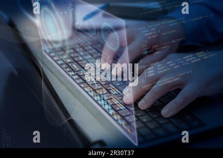 Close-up of a man's hands on a laptop keyboard. Concept of the development of analytical, scientific, statistical and financial applications. Stock Photo