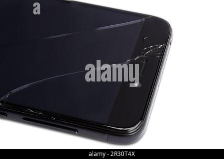 Close-up of a smartphone with a broken display, isolated on a white background Stock Photo