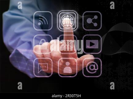 Man touches the icons (hologramms) of cloud technology data storage, network, wi-fi, mobile internet, social networks, emails, cloud storage, multimed Stock Photo