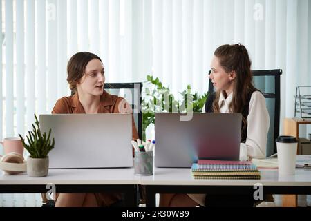 Businessmen discussing work issues and planning new marketing campaign Stock Photo
