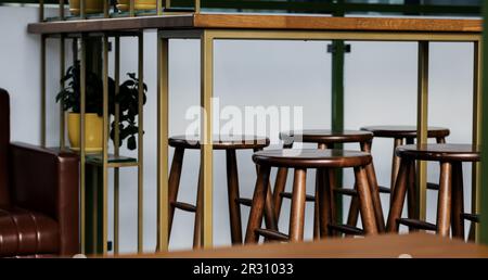 Row of wooden chairs or stools vintage in bar interior retro style decoration Stock Photo