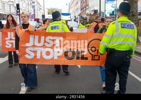 London, England, UK 22 May 2023 Just Stop Oil protesters slow walking bring rush hour traffic on Cromwell Road to a stand still, the protesters have vowed to continue their walks until the government agrees to stop funding all new oil and gas projects. No arrests were made as protesters left the road when a Section 12 was imposed. Stock Photo