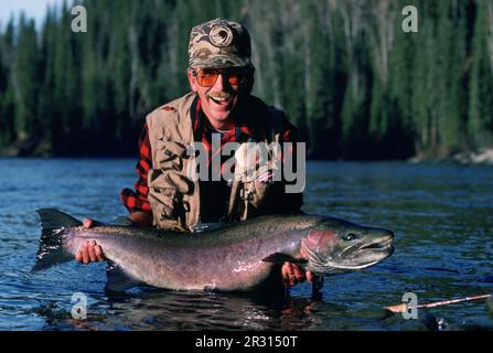 A man holds a rainbow trout caught at Lake Brittany in Bella Vista, Ark.,  U.S.A Stock Photo - Alamy