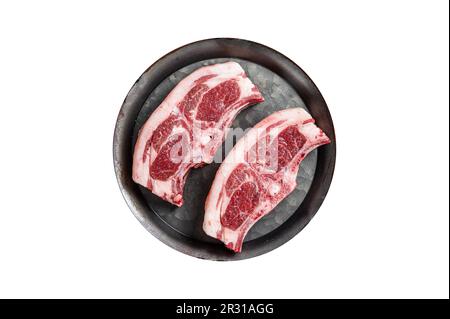 Raw fresh lamb loin chops with herbs and spices in steel tray. Isolated on white background Stock Photo