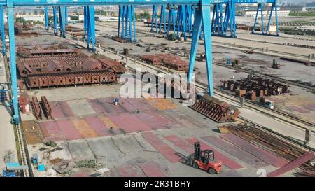 Lianyungang, China. 22nd May, 2023. LIANYUNGANG, CHINA - MAY 22, 2023 - Workers work at a shipbuilding company in Guanyun county, Lianyungang City, East China's Jiangsu Province, May 22, 2023. It is understood that since the beginning of this year, the local shipbuilding industry continues to recover, some shipbuilding enterprises have achieved three consecutive years of order growth, new shipbuilding orders and maintenance orders increa. (Photo by Costfoto/NurPhoto) Credit: NurPhoto SRL/Alamy Live News Stock Photo