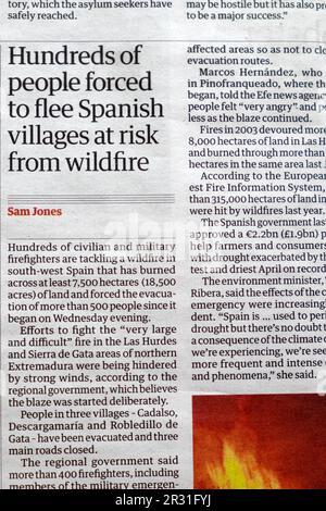 'Hundreds of people forced to flee Spanish villages at risk from wildfire' Guardian newspaper headline climate crisis article 20 May 2023 London UK Stock Photo