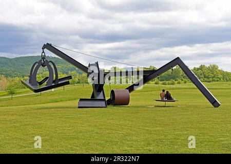 New York, USA. 21st May, 2023. Visitors sit on the wooden swinging bed of Mark di Suvero's artwork 'She' at Storm King Art Center in New York, the United States, on May 21, 2023. Storm King Art Center is a 500-acre outdoor museum located in New York's Hudson Valley, where visitors experience large-scale sculpture and site-specific commissions under open sky. Credit: Li Rui/Xinhua/Alamy Live News Stock Photo