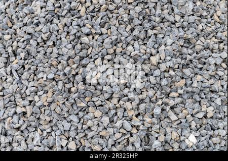Grey granite gravel background for mix concrete. Crushed stone as a background. Construction rock. Banner design Stock Photo