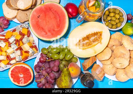 Buon Ferragosto (happy in italian language) holiday background. Summer Italian harvest festival August 15  brunch, family party antipasto foods with w Stock Photo