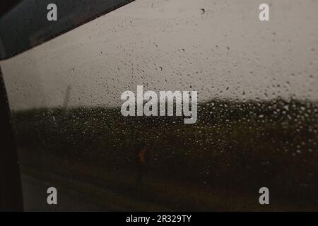 water drops on wet glass window Stock Photo