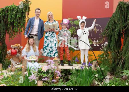 London, UK. 22nd May, 2023. A Mad Hatter's Tea Party at Chelsea Flower Show, in the Teapot Trust Elsewhere Garden, with Kirsten O'Brien reading a story. Credit: Anna Watson/Alamy Live News Stock Photo