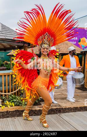 London, UK. 22nd May, 2023. Breeze Houses x Avalana Design, Tradestand, Carnival performers celebrate the launch of Breeze House x Avalana Design, a new biophilic design collaboration. Monday at the 2023 Chelsea Flower Show. Credit: Guy Bell/Alamy Live News Stock Photo