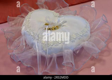 Wedding rings on pillow Stock Photo