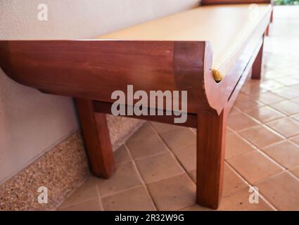 Unoccupied wooden bed chair in living room Stock Photo