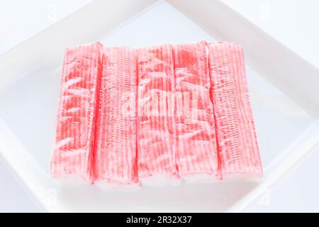 Group of crab sticks  on white plate Stock Photo