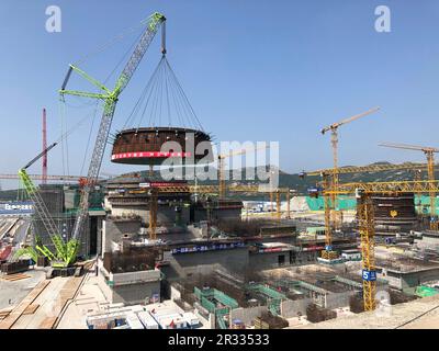 (230522) -- LIANYUNGANG, May 22, 2023 (Xinhua) -- This photo taken on May 19, 2023 shows a crawler crane lifting the circular belt of the reactor dome of the Tianwan nuclear power plant Unit 7 in east China's Jiangsu Province. TO GO WITH 'Across China: Tianwan nuclear power plant installs key component of Unit 7' (China National Nuclear Corporation/Handout via Xinhua) Stock Photo