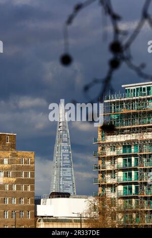 Apartment buildings on the Albert Embankment / South Bank and The Shard Tower under a stormy sky, London, UK Stock Photo