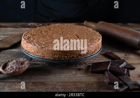 Fresh baked torta caprese. Italian chocolate, almond cake on rustic and wooden table. Stock Photo