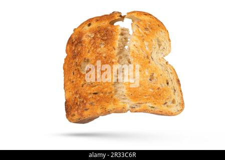 The isolate of a slice of white bread is broken into two parts. Toaster fried bread isolated on white background. The concept of a small, dietary Stock Photo