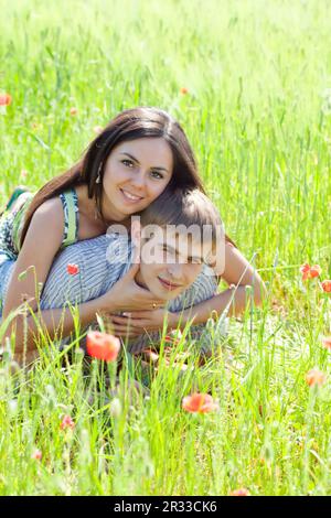 Couple in poppy field Stock Photo