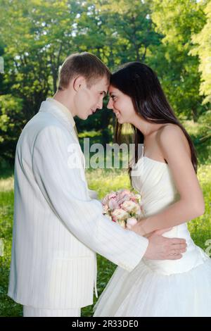 Wedding couple are smiling outdoor Stock Photo - Alamy