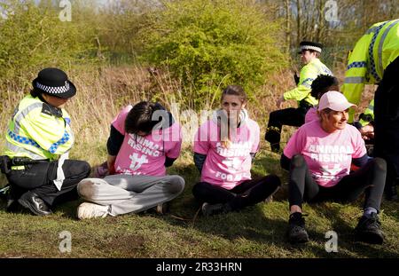 File photo dated 15-04-2023 of Protesters are detained by police during day three of the Randox Grand National Festival. The Jockey Club has lodged an application to the High Court seeking an injunction to prohibit acts intended to disrupt the Derby Festival, which takes place at Epsom on June 2 and 3. Issue date: Monday May 22, 2023. Stock Photo