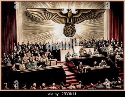 Adolf Hitler delivering a speech at Kroll Opera House (colour image) before the men of the Reichstag on the subject of Roosevelt and the war in the Pacific, declaring war on the United States. Next to Hitler in the government benches (from right to left) are Joachim von Ribbentrop, Erich Raeder, Walther von Brauchitsch, Wilhelm Keitel, Wilhelm Frick and Joseph Goebbels. 28/4/1939 Stock Photo