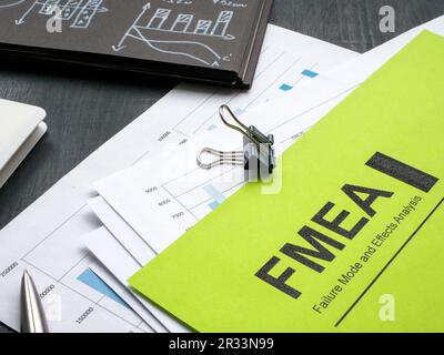 Stack of papers with FMEA failure mode and effects analysis and pen. Stock Photo