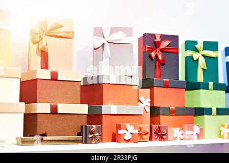 Gift boxes with ribbons on a store shelf Stock Photo