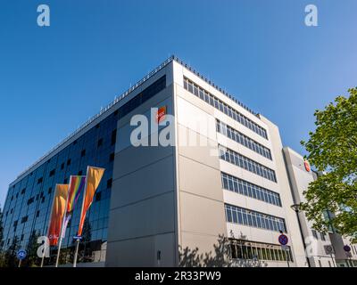 Building exterior of the pharmaceutical company GSK in Saxony. Modern industrial architecture and production hall of medical and consumer products. Stock Photo