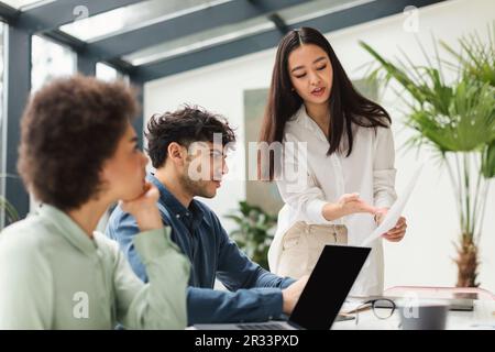 Diverse Business Team Analyzing Problems Working On Project In Office Stock Photo
