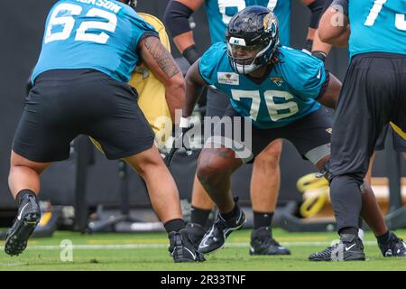 Jacksonville Jaguars offensive tackle Anton Harrison (76) defends