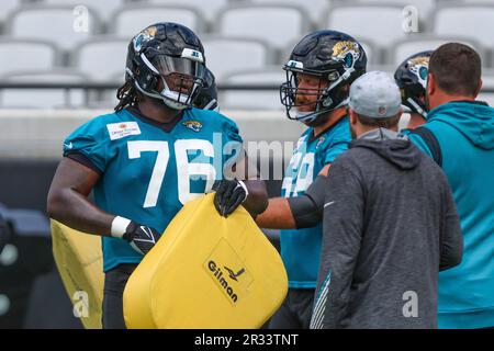 Jacksonville Jaguars offensive tackle Anton Harrison (76) puts on