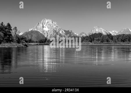 Grand Teton mountain peaks reflection by Snake River in Black and White, Grand Teton national park, Wyoming, USA. Stock Photo