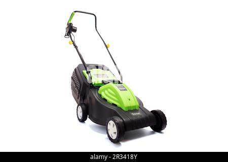 Garden electric lawn mower with a grass collector isolated on white background Stock Photo