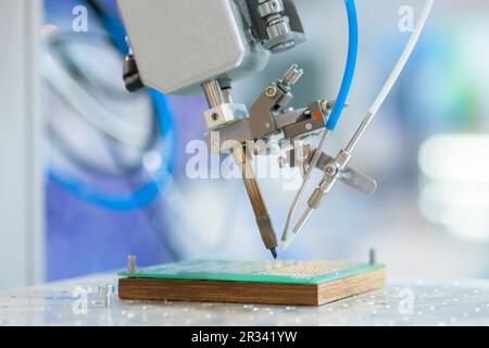 Process of selective soldering components to printed circuit boards at factory Stock Photo