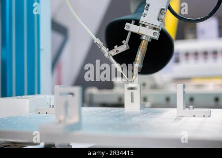 Process of selective soldering components to printed circuit boards at factory Stock Photo