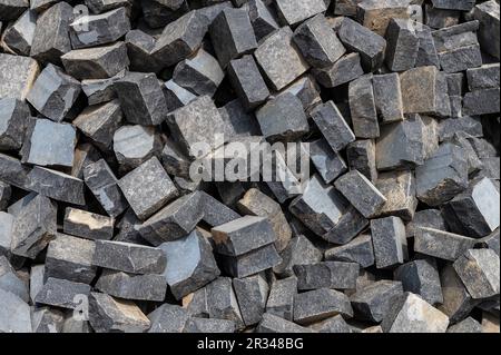 Large gray granite gravel background. Rubble as a background. Building stone. Banner design Stock Photo
