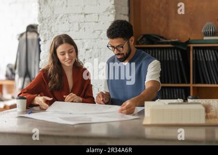 Young couple working as architects in the office. Stock Photo