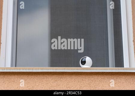 Close-up home security camera 360 on the window. CCTV security camera. Technologies for monitoring and protection of territory Stock Photo