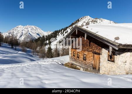 Alp hut in front of Mt. Watzmann in winter Stock Photo