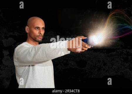Man holding flashlight with effects. Stock Photo