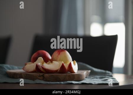 ripe nectarines on wood board with natural lighting, shallow focus Stock Photo